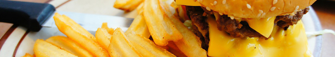 Eating American (Traditional) Burger Sandwich at Trackside Grill restaurant in Ashland, VA.